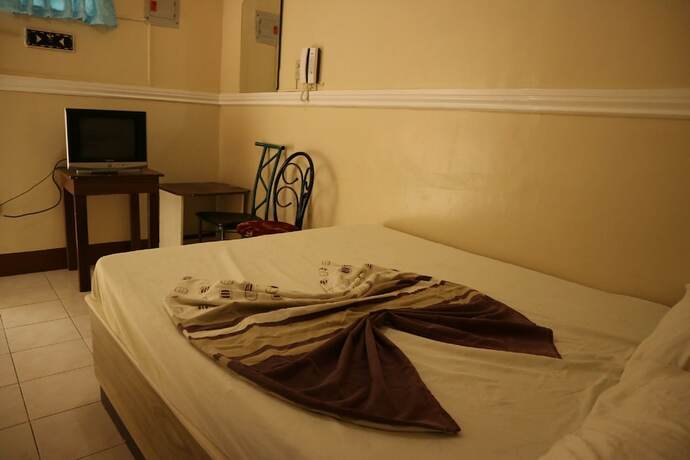 Imagen de la habitación del Hotel Oyo 1048 Jomckayl Apartelle. Foto 14