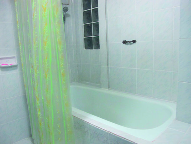 Imagen de la habitación del Hotel Oyo 1068 Nn Apartment. Foto 10