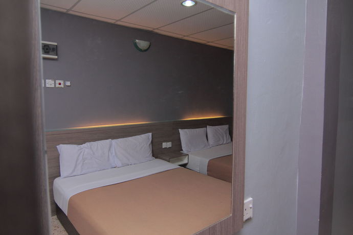 Imagen de la habitación del Hotel Oyo 1088 Yellow Mansion Banda Kaba. Foto 7