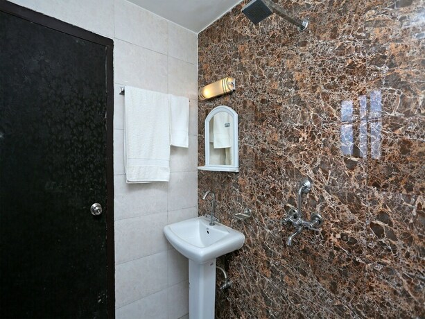 Imagen de la habitación del Hotel Oyo 10948 Home Modern Studio Bhumiyadhar. Foto 6