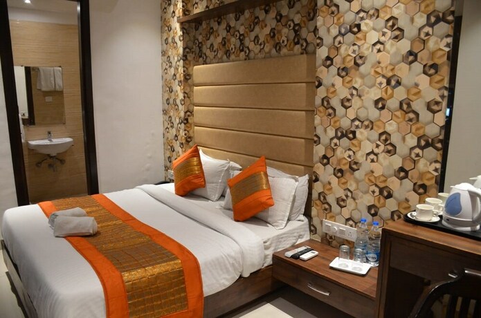 Imagen de la habitación del Hotel Oyo 11680 Grand Star. Foto 6