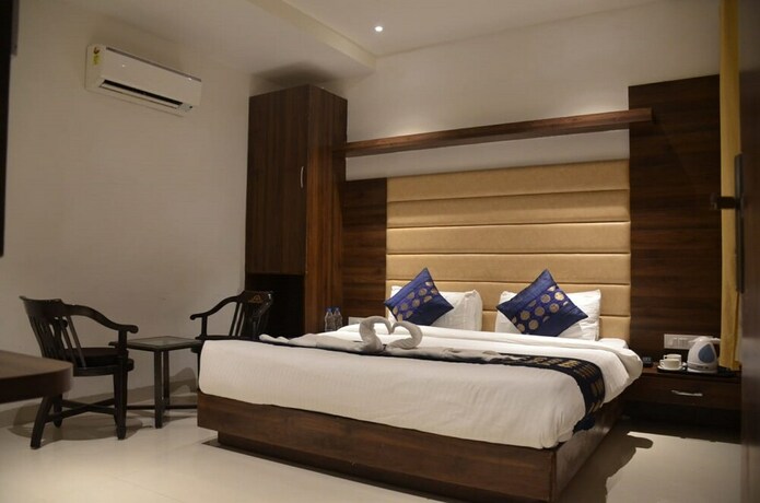 Imagen de la habitación del Hotel Oyo 11680 Grand Star. Foto 7