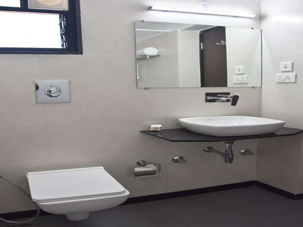 Imagen de la habitación del Hotel Oyo 11950 Relax Holiday Home. Foto 12