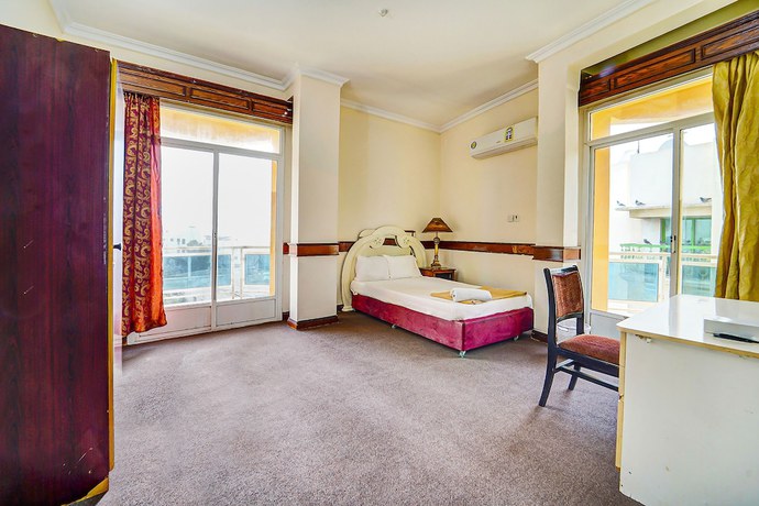 Imagen de la habitación del Hotel Oyo 120 Concord International. Foto 2