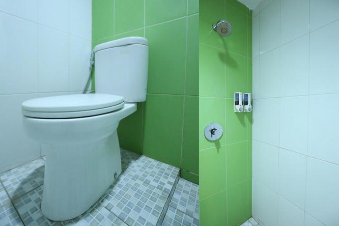 Imagen de la habitación del Hotel Oyo 136 Manggis Inn. Foto 13