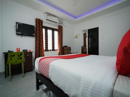 Imagen de la habitación del Hotel Oyo 14270 Marottickal Residency. Foto 10