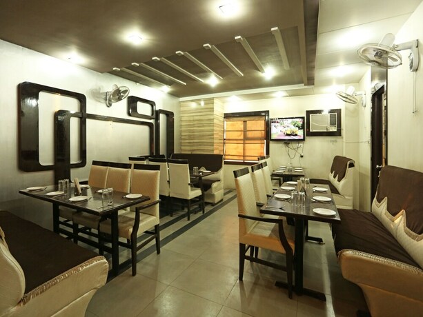 Imagen del bar/restaurante del Hotel Oyo 1671 Sundaram. Foto 16