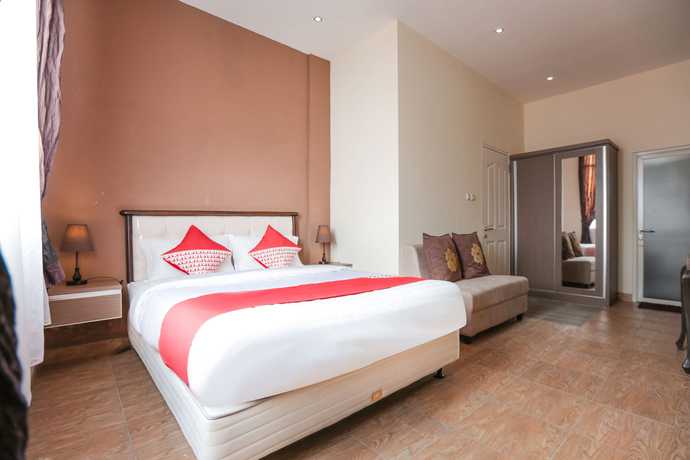 Imagen de la habitación del Hotel Oyo 170 Koen View. Foto 12