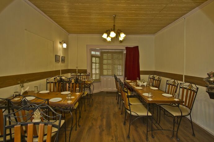 Imagen del bar/restaurante del Hotel Oyo 1706 The Alpine Heritage Residency. Foto 5