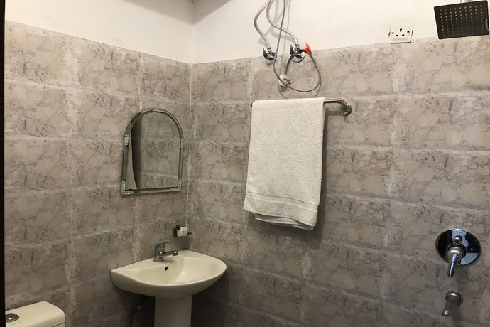 Imagen de la habitación del Hotel Oyo 17443 Tirupati Residency. Foto 16