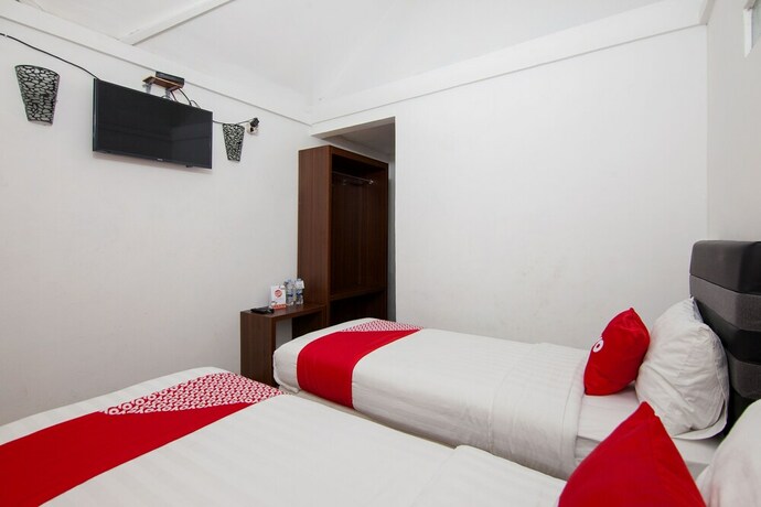 Imagen de la habitación del Hotel Oyo 1812 Dg Inn. Foto 16