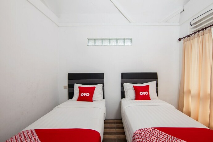 Imagen de la habitación del Hotel Oyo 1812 Dg Inn. Foto 32