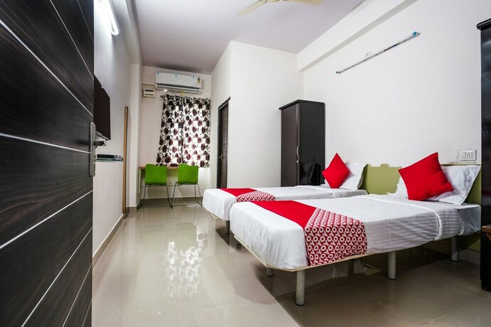 Imagen de la habitación del Hotel Oyo 22074 Siri Elite. Foto 7