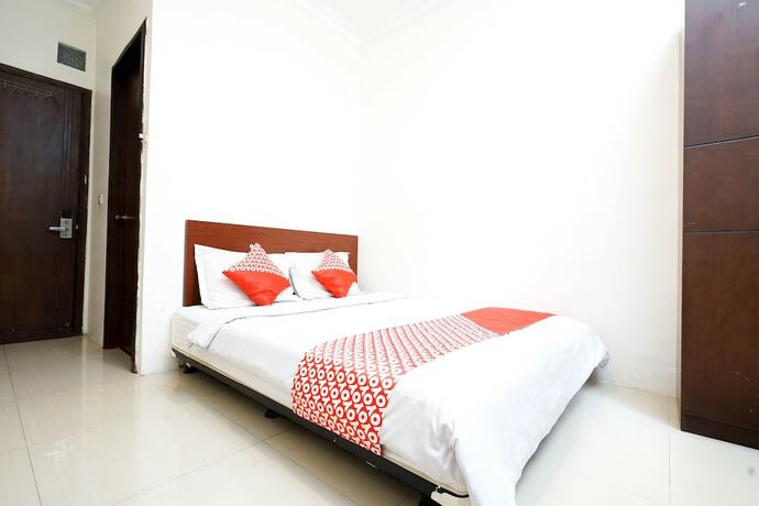 Imagen de la habitación del Hotel Oyo 2400 Maleo Exclusive Residence. Foto 18