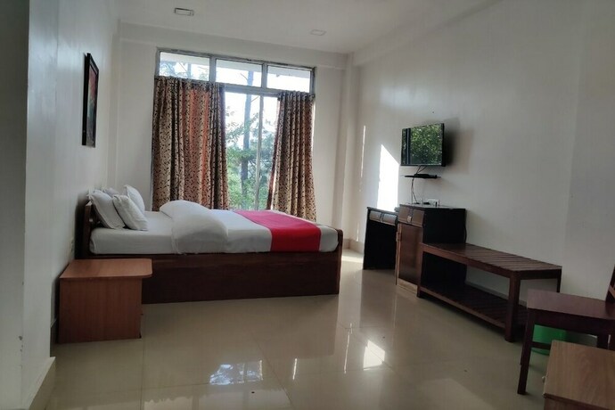 Imagen de la habitación del Hotel Oyo 2402 Highwinds. Foto 11