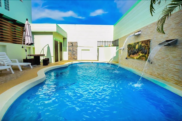 Imagen de la piscina del Hotel Oyo 242 Baan Noppadol Hua Hin Resort. Foto 15