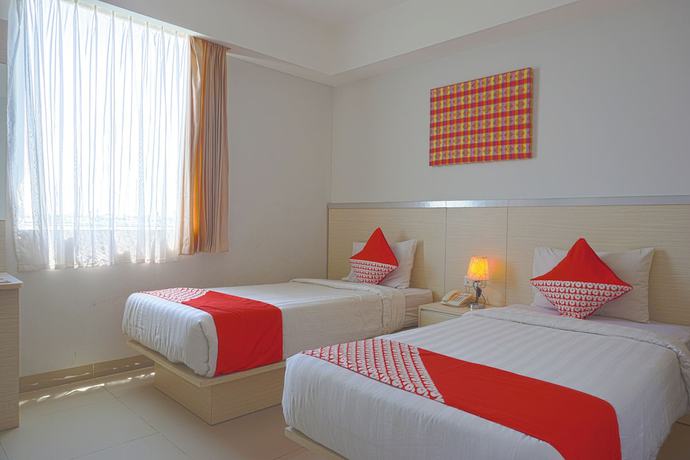 Imagen de la habitación del Hotel Oyo 3269 Grand Sayang Park Makass. Foto 3