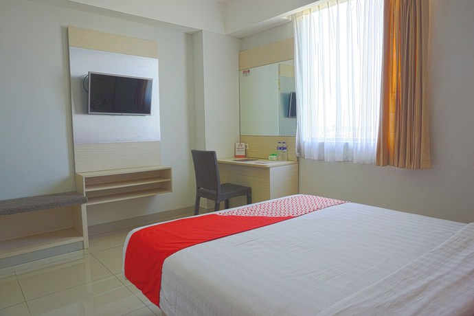 Imagen de la habitación del Hotel Oyo 3269 Grand Sayang Park Makass. Foto 6