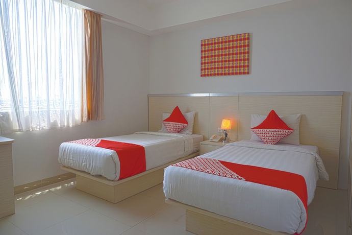 Imagen de la habitación del Hotel Oyo 3269 Grand Sayang Park Makass. Foto 8