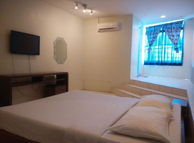 Imagen de la habitación del Hotel Oyo 44034 Furama Lodging House. Foto 10