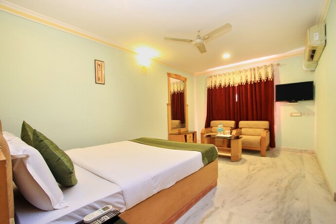 Imagen de la habitación del Hotel Oyo 4531 Pleasant Stay Inn. Foto 10