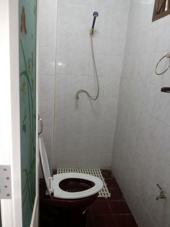 Imagen de la habitación del Hotel Oyo 471 Sunshine Apartment. Foto 10