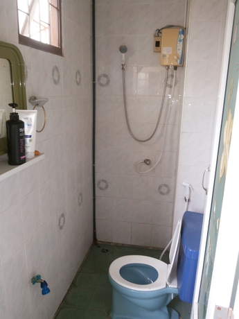 Imagen de la habitación del Hotel Oyo 471 Sunshine Apartment. Foto 11
