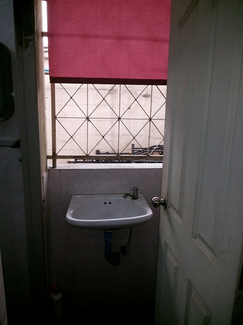 Imagen de la habitación del Hotel Oyo 471 Sunshine Apartment. Foto 12