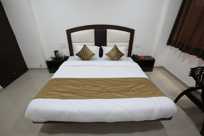 Imagen de la habitación del Hotel Oyo 4856 The Benz. Foto 15