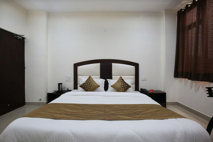 Imagen de la habitación del Hotel Oyo 4856 The Benz. Foto 17