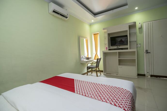 Imagen de la habitación del Hotel Oyo 523 Dedy Beach Inn. Foto 12