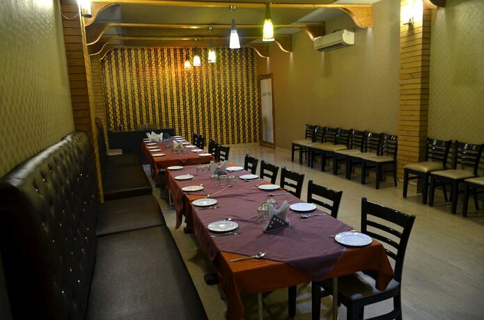 Imagen del bar/restaurante del Hotel Oyo 5389 Polo Club. Foto 2