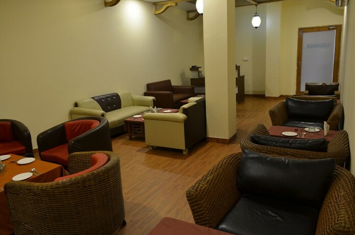 Imagen del bar/restaurante del Hotel Oyo 5389 Polo Club. Foto 4