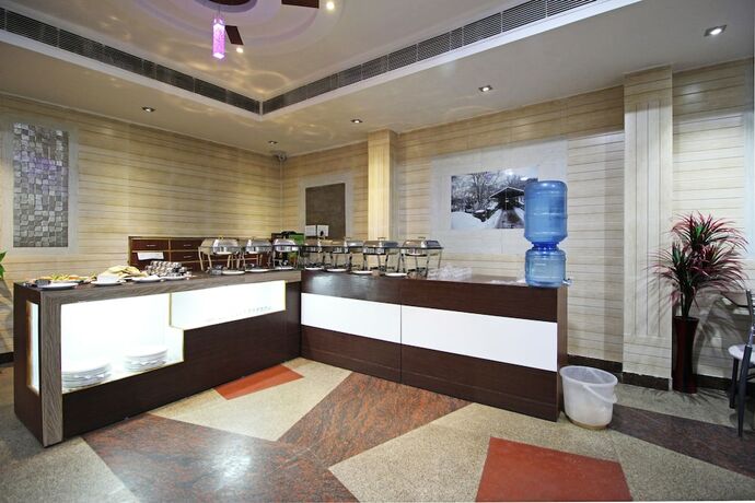 Imagen del bar/restaurante del Hotel Oyo 5539 Merit. Foto 5
