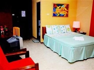 Imagen de la habitación del Hotel Oyo 599 Palawan Village. Foto 10