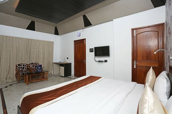 Imagen de la habitación del Hotel Oyo 6680 Galaxy International. Foto 9