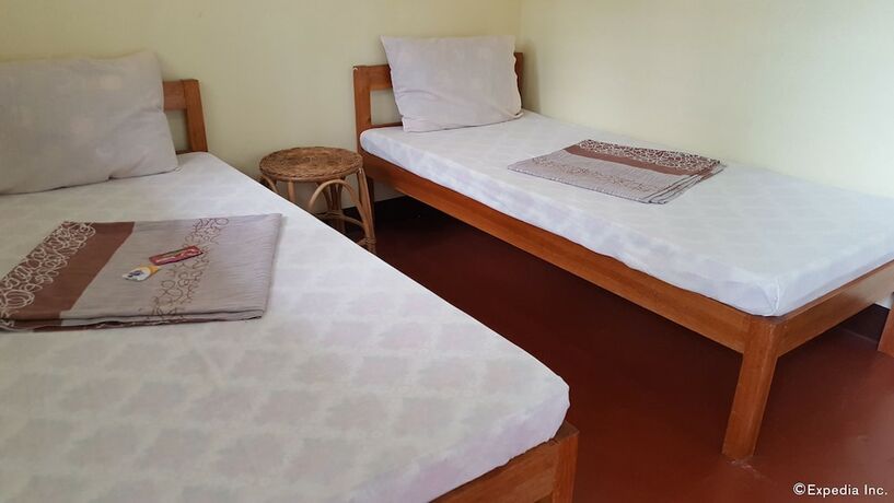 Imagen de la habitación del Hotel Oyo 671 Natua's Cabin. Foto 18