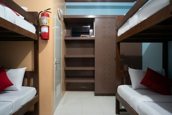 Imagen de la habitación del Hotel Oyo 702 Queens Hometel. Foto 3