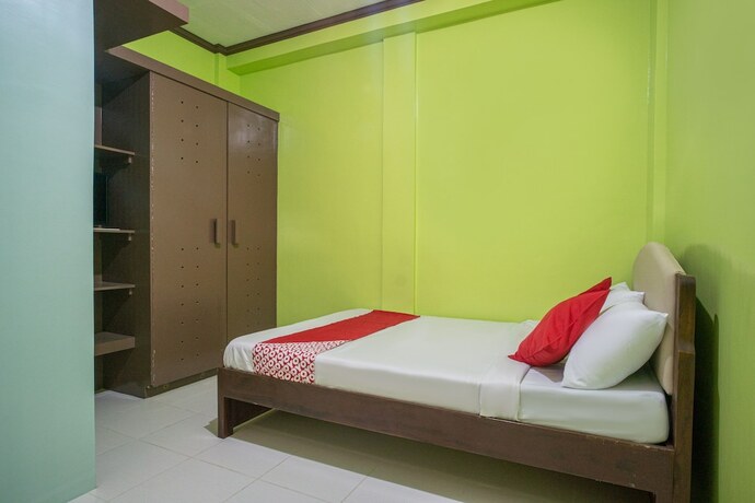 Imagen de la habitación del Hotel Oyo 702 Queens Hometel. Foto 4
