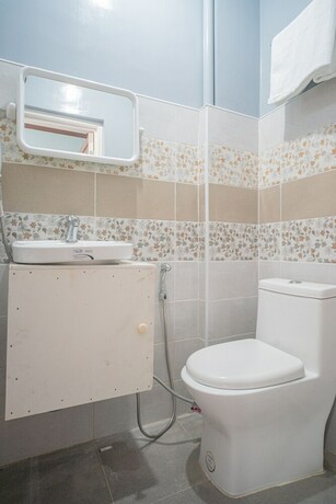 Imagen de la habitación del Hotel Oyo 702 Queens Hometel. Foto 5