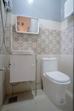 Imagen de la habitación del Hotel Oyo 702 Queens Hometel. Foto 6