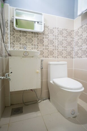 Imagen de la habitación del Hotel Oyo 702 Queens Hometel. Foto 16