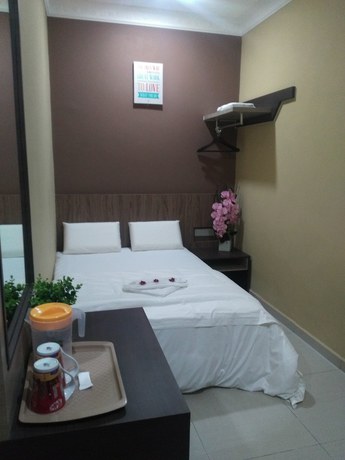 Imagen de la habitación del Hotel Oyo 721 Silibin Times Inn. Foto 9