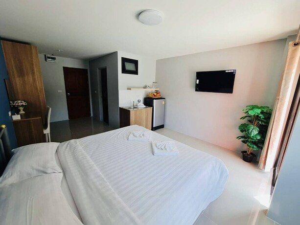 Imagen de la habitación del Hotel Oyo 75403 Dinosaur Apartment. Foto 11