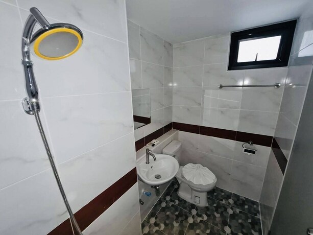 Imagen de la habitación del Hotel Oyo 75403 Dinosaur Apartment. Foto 12