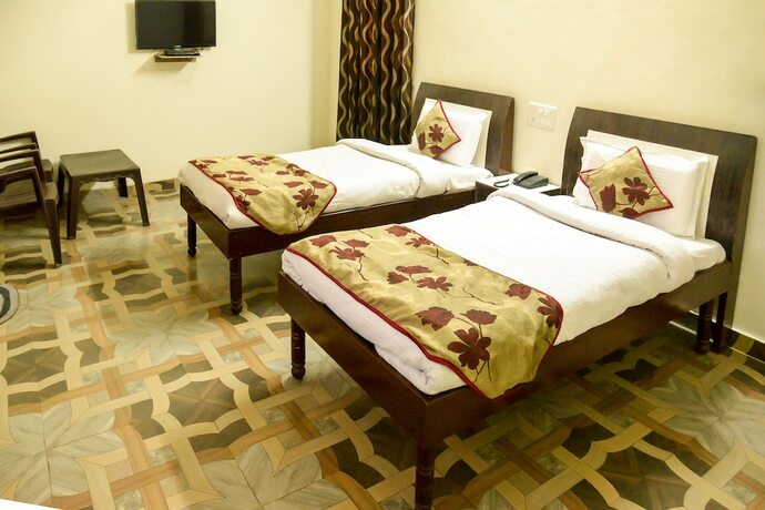 Imagen de la habitación del Hotel Oyo 7609 Dolphin. Foto 22