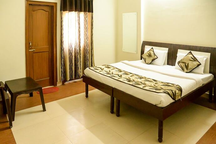 Imagen de la habitación del Hotel Oyo 7609 Dolphin. Foto 23