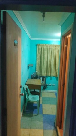 Imagen de la habitación del Hotel Oyo 772 Remedios Apartment. Foto 19