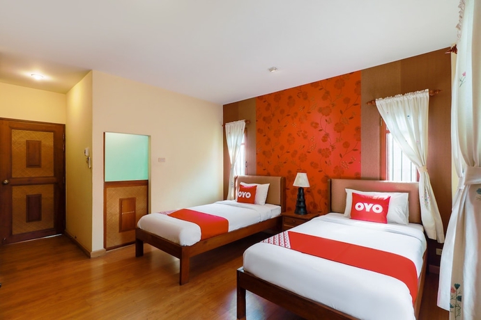 Imagen de la habitación del Hotel Oyo 780 Plumeria Home. Foto 13