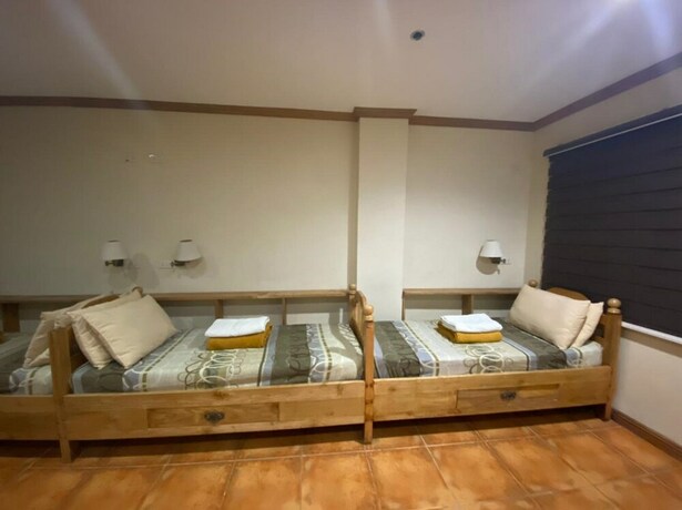 Imagen de la habitación del Hotel Oyo 797 Brickwood Suites. Foto 5